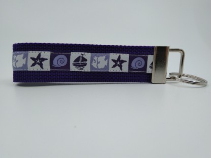 Bild von Schlüsselanhänger Muschel und Schiff violett