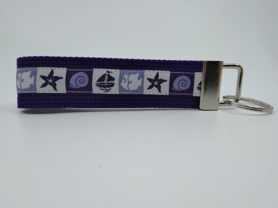 Bild von Schlüsselanhänger Muschel und Schiff violett